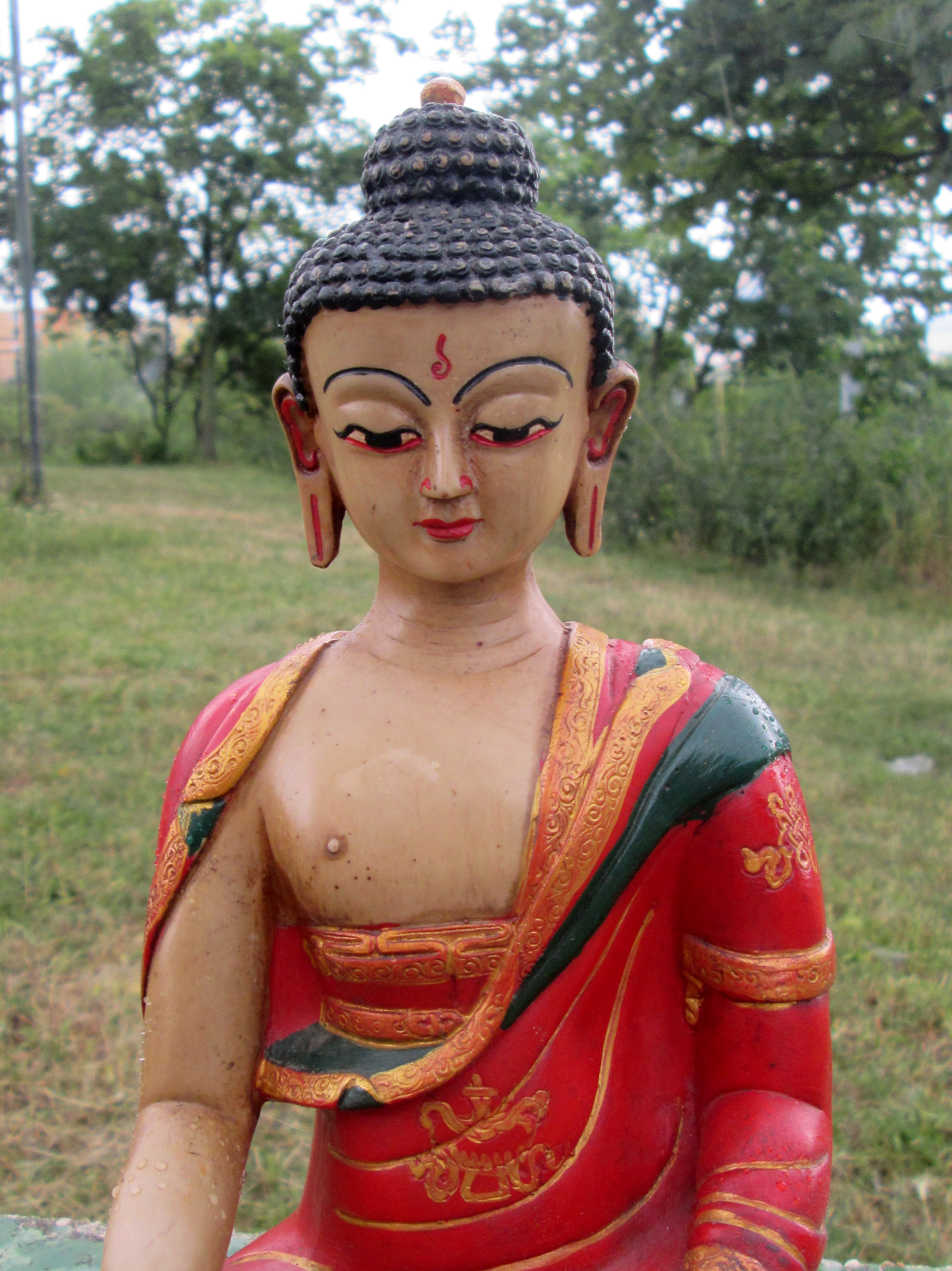 Buddha s gestem probuzení